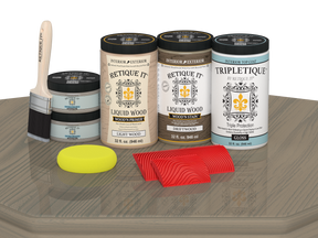 Retique It Wood'n Finish Kit with four large driftwood stain bottles, glossy finish, shown on a table surface.