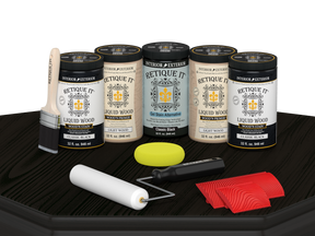 Retique It Classic Black Kit with Liquid Wood, Classic Black Gel Stain Alternative, yellow sponge, red graining tool, roller, and brush.