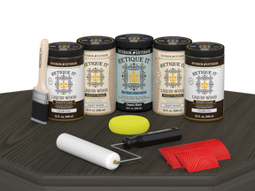 Retique It Charcoal Kit with Liquid Wood, Classic Black Gel Stain Alternative, yellow sponge, red graining tool, roller, and brush.