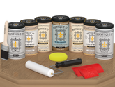 Retique It Wood'n Door Kit in Pickled Oak stain, featuring front and garage door stain samples on a table.