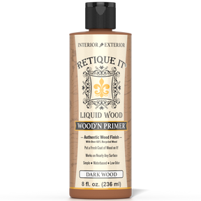 Retique It® Liquid Wood Wood'n Primer in Dark Wood, 8 fl oz, applied to a surface for a smooth, dark wood finish.