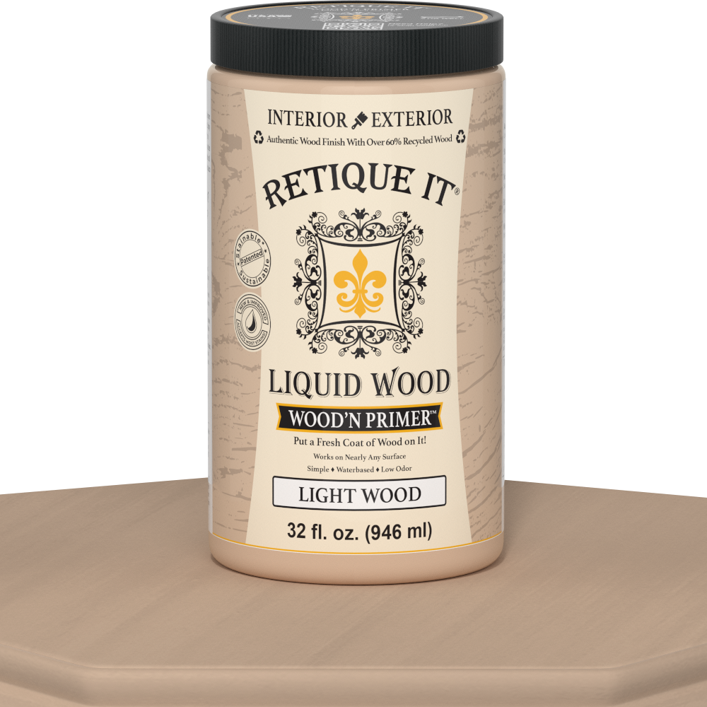 Retique It® Liquid Wood Wood'n Primer in light wood finish, 32 fl oz, shown on a table surface for wood crafting projects.