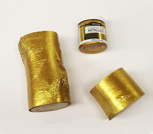 DecoArt Metallics 24K Gold paint set with three bottles of shimmering gold acrylic paint for arts and crafts projects.