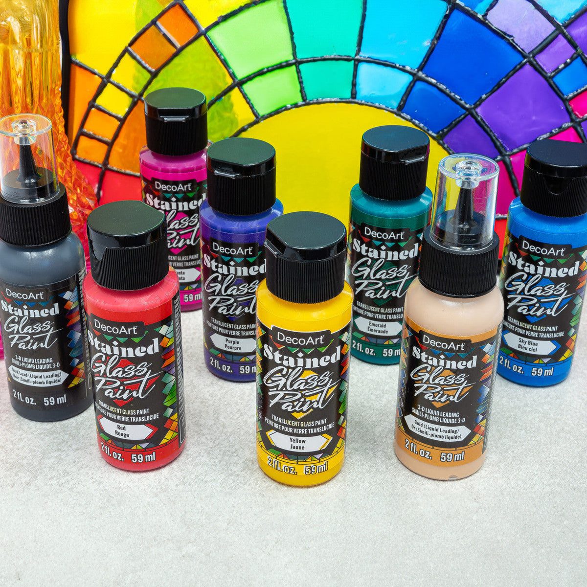 Rainbow Stained Glass Paint Set by DecoArt featuring vibrant glass paints and brushes for creating colorful stained glass art.