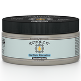 Retique It Weathered Wood Gel Stain applied to a wooden surface, showcasing a rustic, weathered finish with natural wood grain.